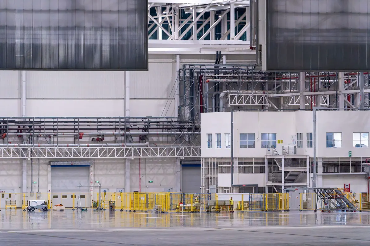 Modern industrial factory interior with manufacturing machinery