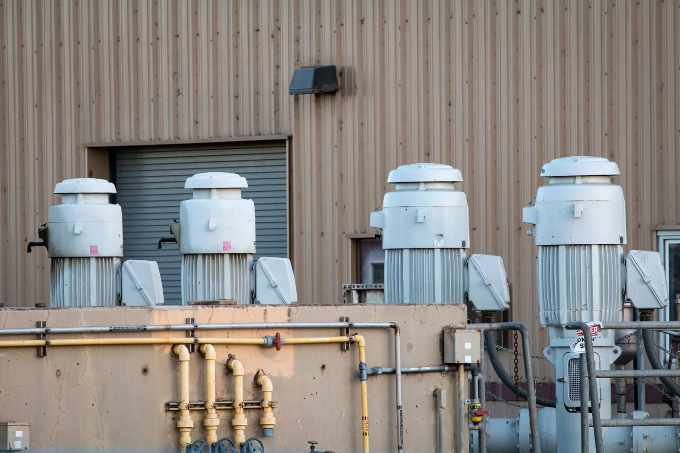 Exterior of an industrial plant with piping and large process equipment