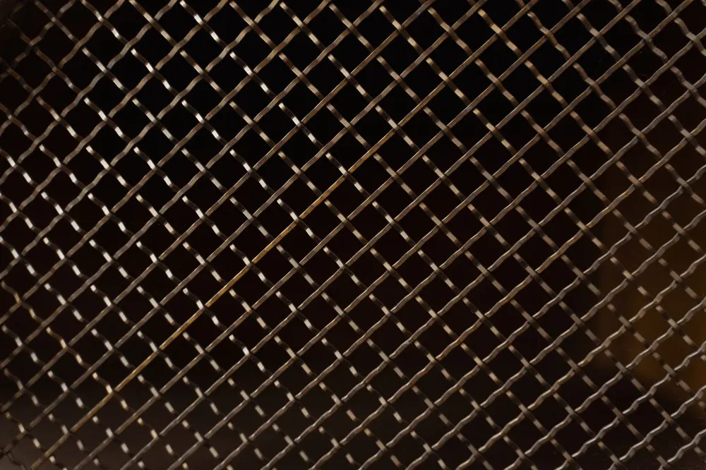 Close-up of squared industrial metal mesh fencing