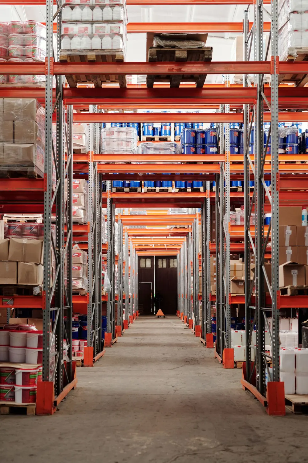 Tall warehouse racking aisle representing dense automated storage concepts