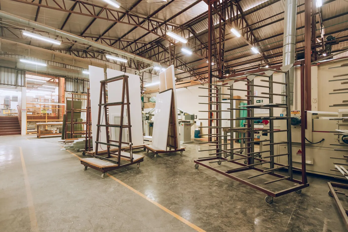Spacious modern industrial factory workshop with machinery and open floor space